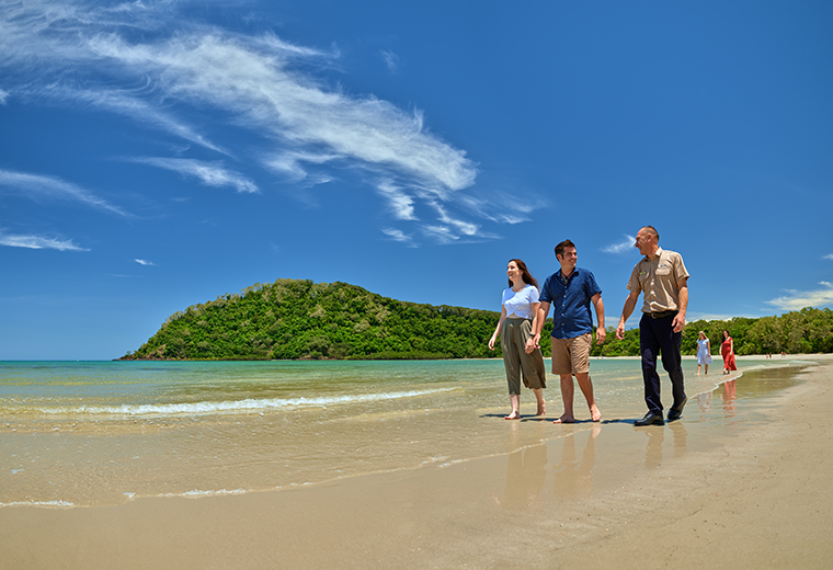 Passengers with guide walking on Cape Tribulation Beach